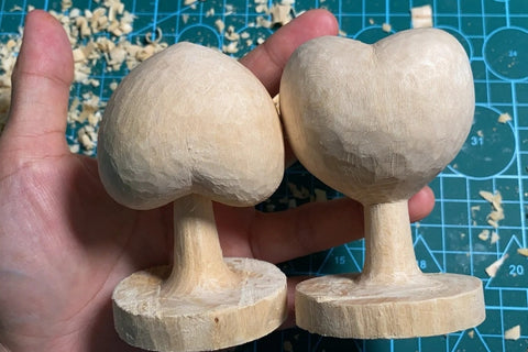Finished upright and inverted heart trees on solid round bases