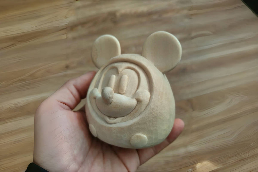 Finished natural-wood Mickey Mouse carving