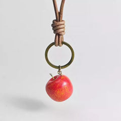 Wooden apple keychain hanging from key ring