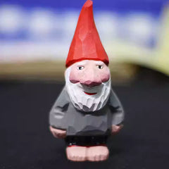 Front view of the hand‑carved Santa Claus wooden figurine wearing a red hat and gray coat, perfect for vintage holiday décor.