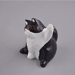 Black and white cat figurine angled view