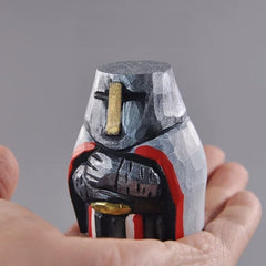 Chibi knights templar figurine held in hand for size