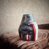 Chibi knights templar figurine on a wooden surface