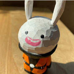 Whimsical hand-painted bunny in jester costume, perfect for Easter decoration.