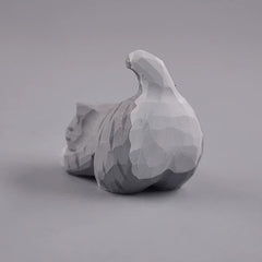 Gray cat figurine rear view with tail up