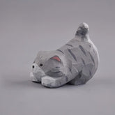 Gray cat figurine side view with raised tail