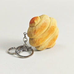 Wooden bread keychain with metal ring