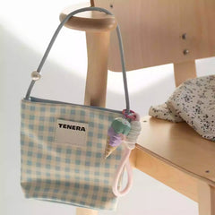 Ice cream wooden keychain attached to bag strap