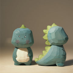 Front view of kawaii dinosaur figurine showing a playful image.