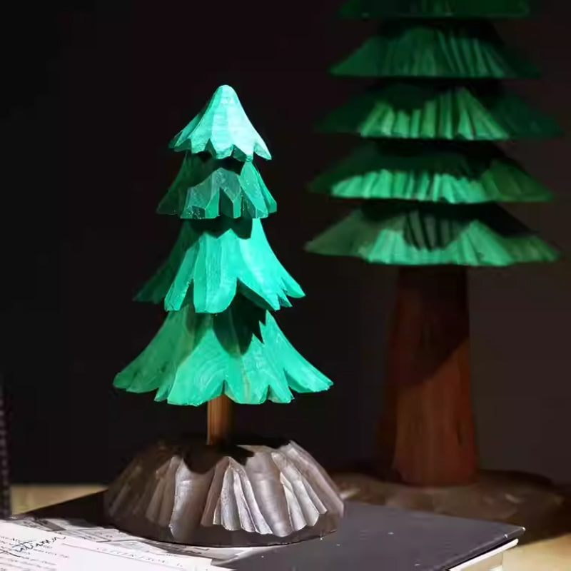 Medium layered wooden Christmas tree displayed in front of the taller Large tree