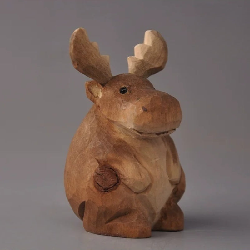 Seated Moose figurine with pale palmate antlers and an earthy brown finish