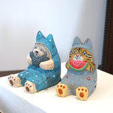 Side view of sitting cat wooden phone holder