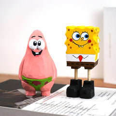 Spongebob Squarepants wooden carving with a smiling Patrick Star figure beside it.