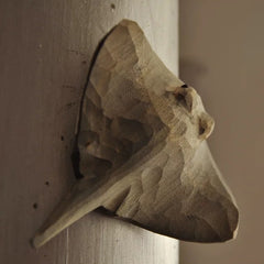 Angled view of hand-carved stingray magnet