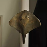 Stingray magnet mounted on a white door frame