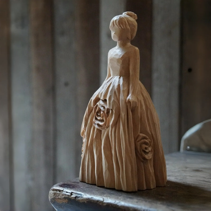 unfinished custom wooden bride figurine on work table