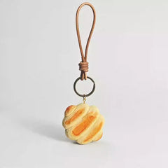 Wooden bread keychain with leather strap