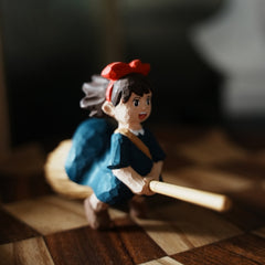 Wooden Kiki figurine flying on broom