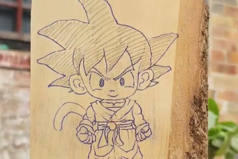 Young Goku reference drawing with a large head on a wood block