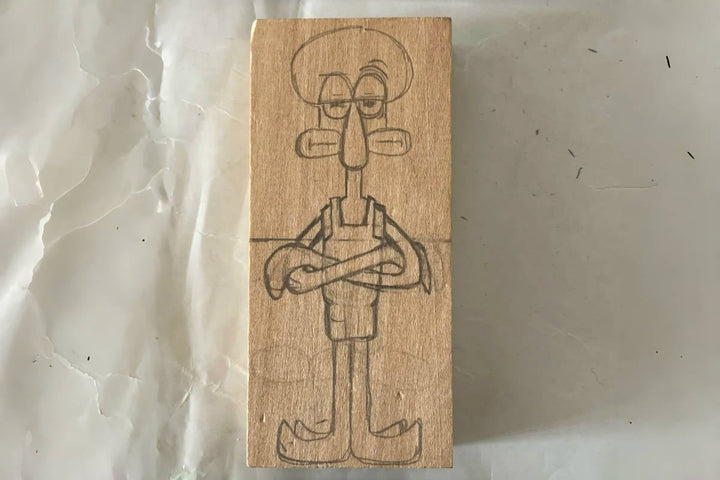 How to Carve a Wooden Squidward Figure from a Cartoon Reference