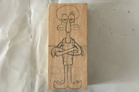 How to Carve a Wooden Squidward Figure from a Cartoon Reference