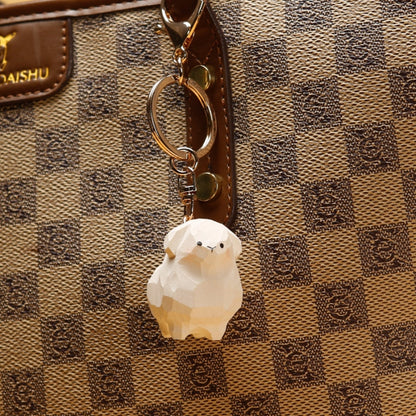 Wooden sheep keychain on bag