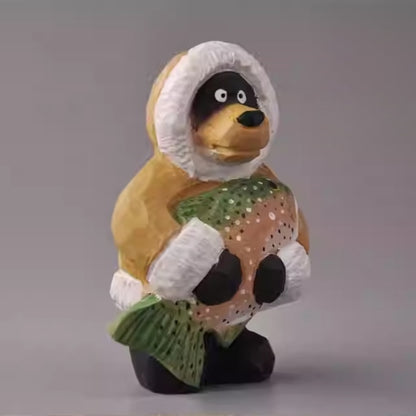 Side view of wooden bear figurine holding fish