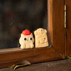 Wooden animal fridge magnets on window frame