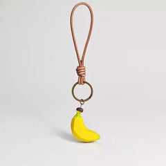 Wooden banana keychain with leather loop