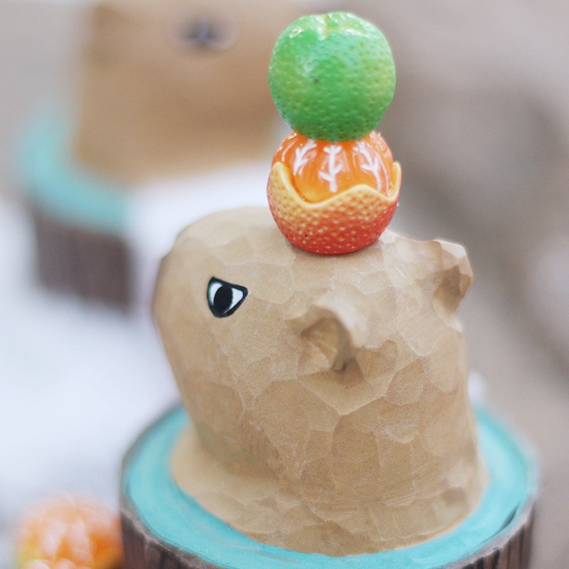 Back view of a bubble bath styled capybara figure.