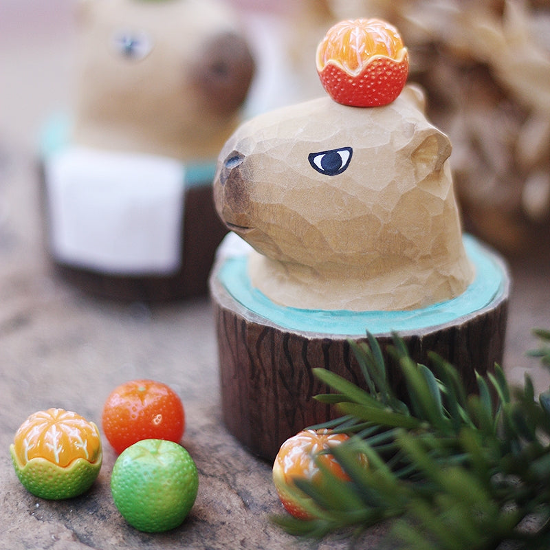 Side view of the capybara figure showcases exquisite handmade wood carvings.