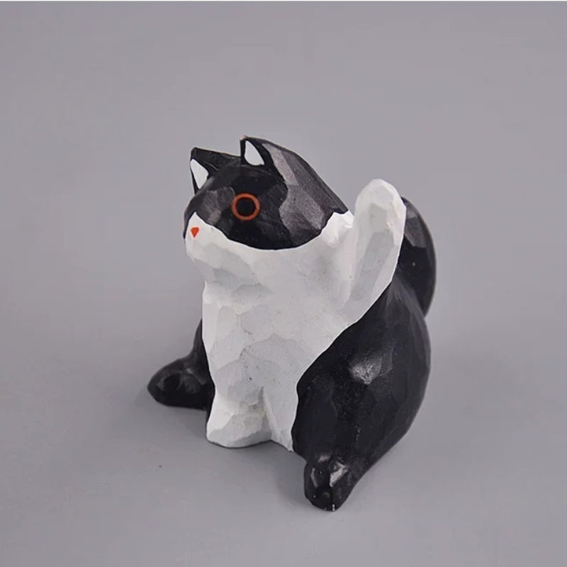 Black and white cat figurine angled view