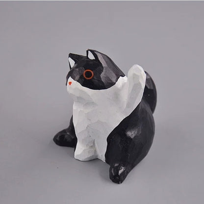 Black and white cat figurine angled view