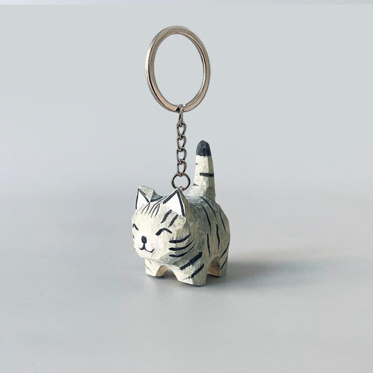 Hand-carved black stripe gray cat keychain with a smiling face.