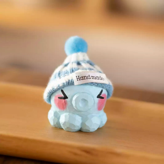 Blue octopus figurine with knit hat