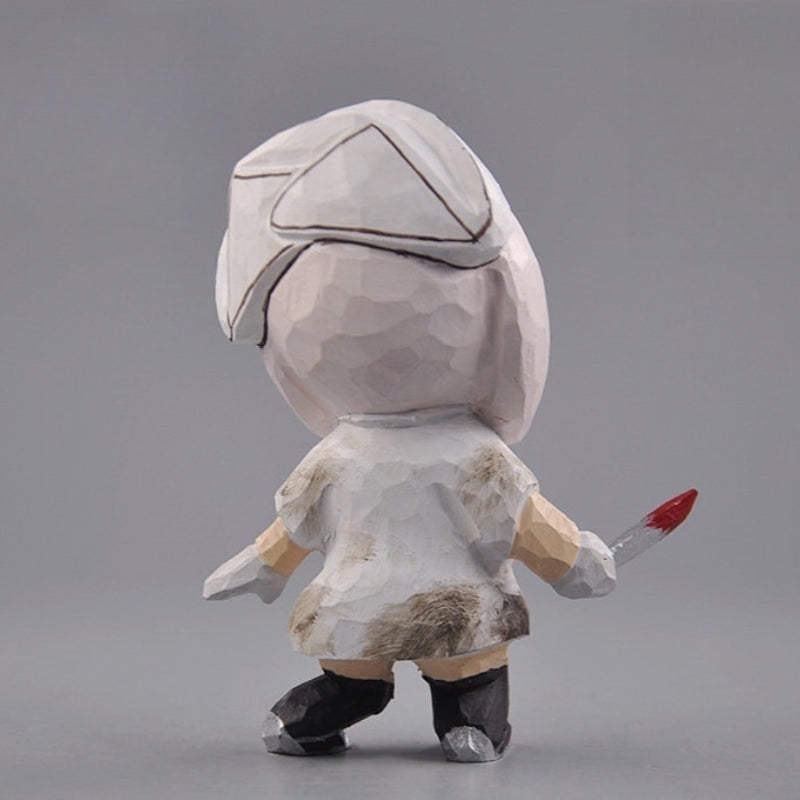 Back of the wooden nurse figurine showing the cap and painted brown stains on the white dress
