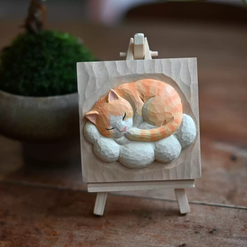 Cat sleeping on cloud wood carving on easel