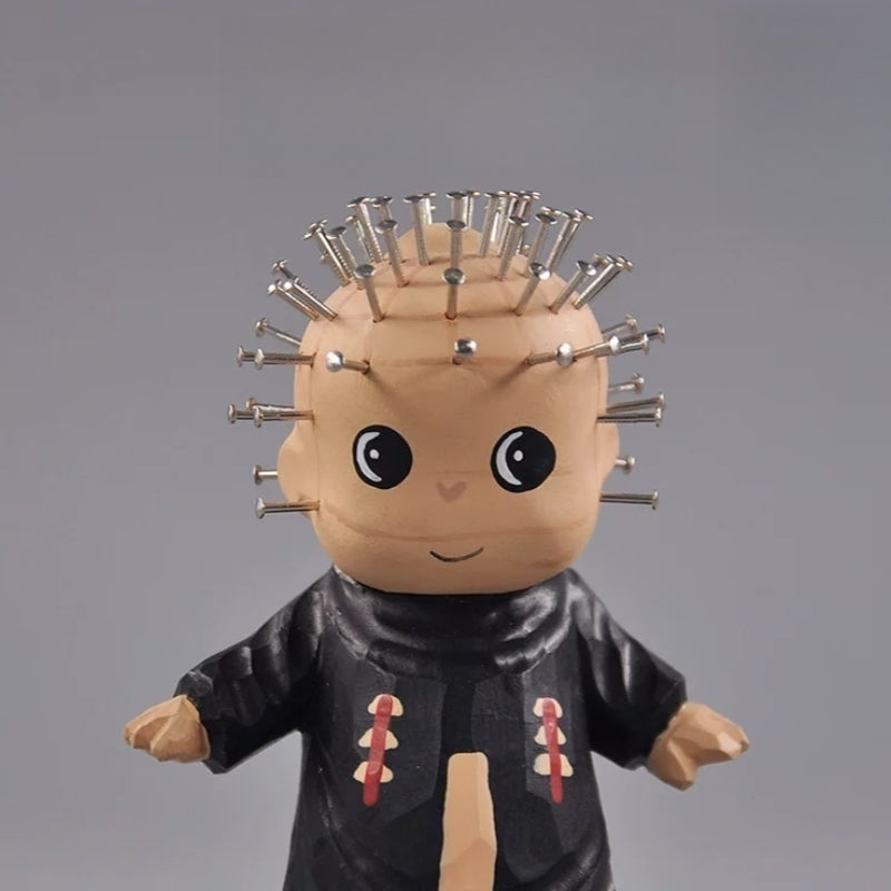 Close-up of chibi pinhead figurine face