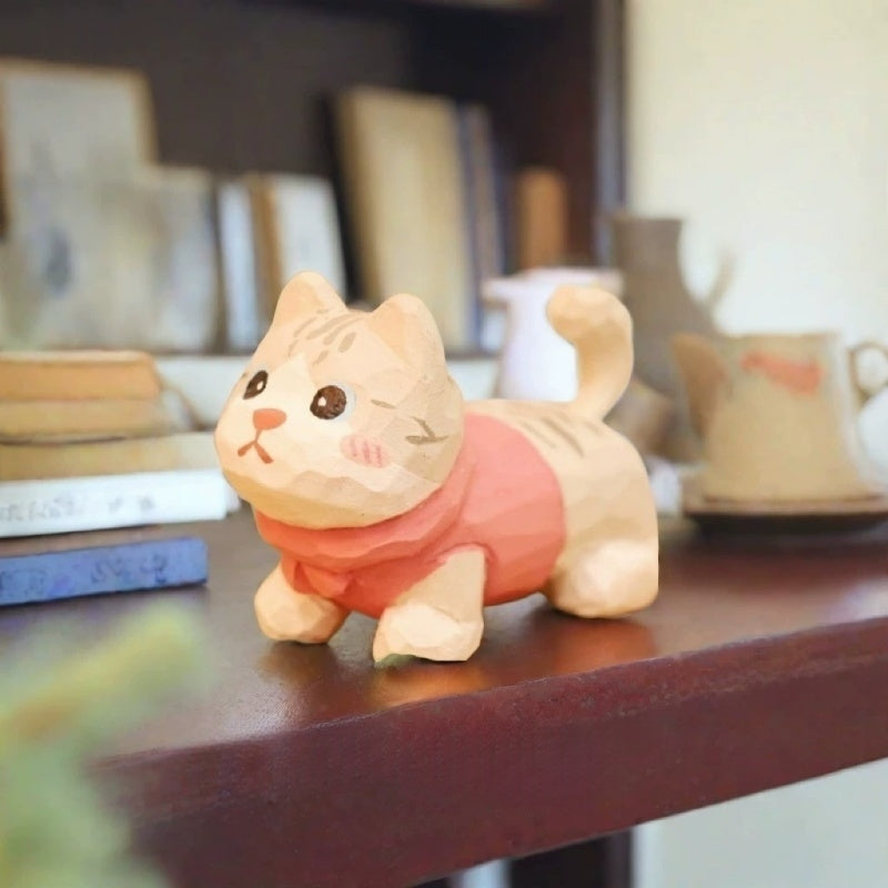 Cream tabby kitten figurine in pink sweater
