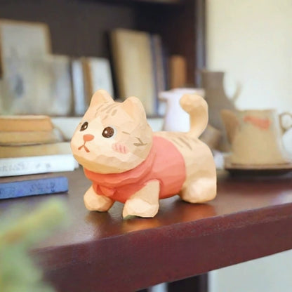 Cream tabby kitten figurine in pink sweater