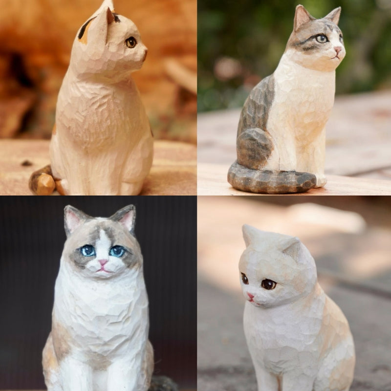 Four custom cat statues in various poses and colors, capturing the personality of each feline through carving and hand-painting.