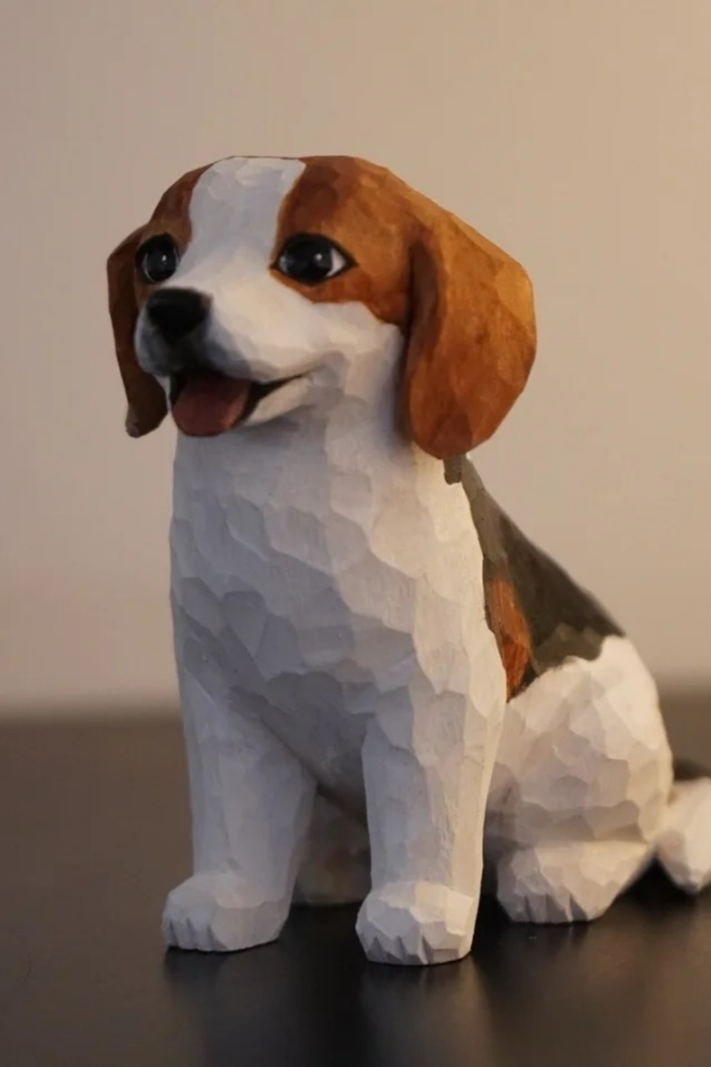 Hand-carved wooden Beagle figurine with brown ears, a white chest, and an open mouth.