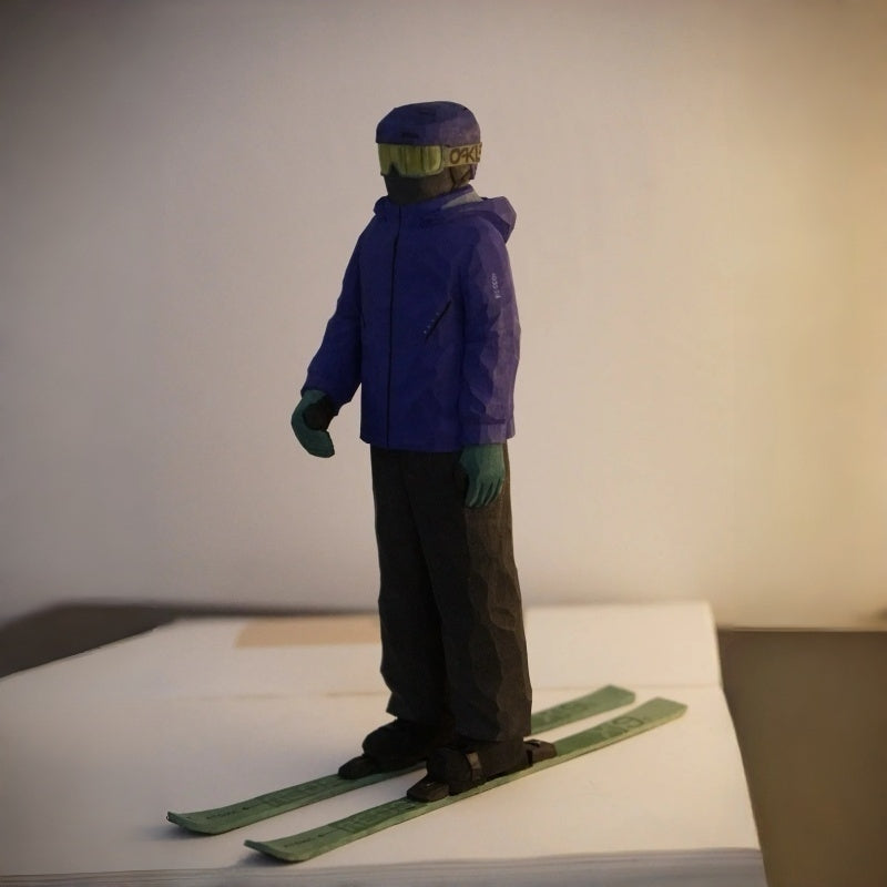 Side view of custom ski figurine made from photo, showcasing skier pose and wooden carving