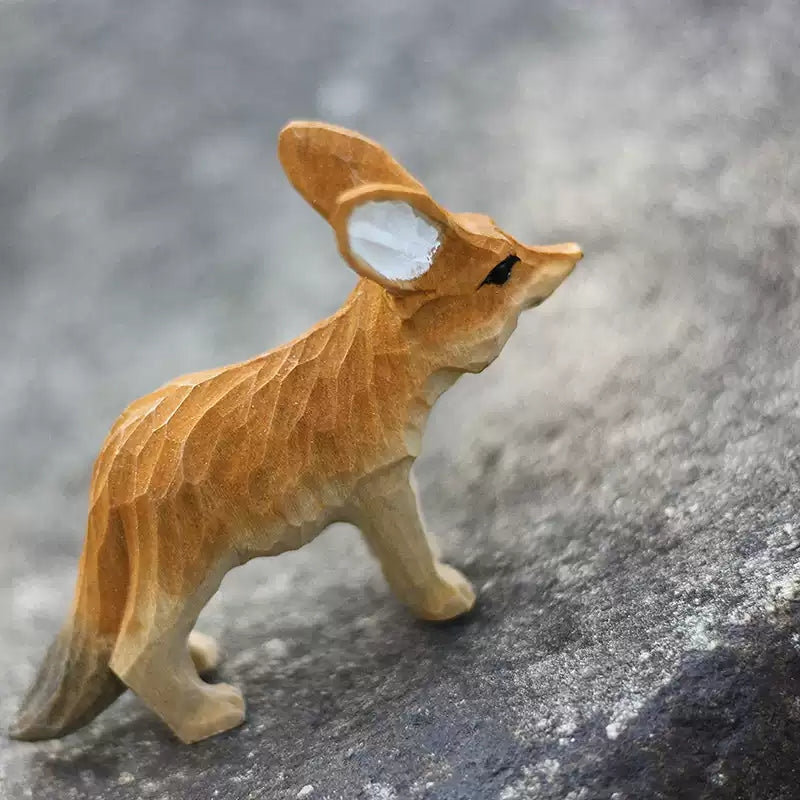 Three-quarter rear view of fennec fox figurine with head up