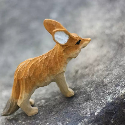 Three-quarter rear view of fennec fox figurine with head up