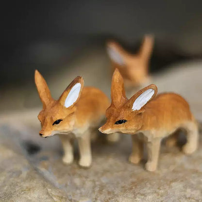 Two fennec fox figurines close-up