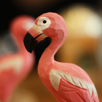 Flamingo wood carving showing the black-tipped beak and carved head