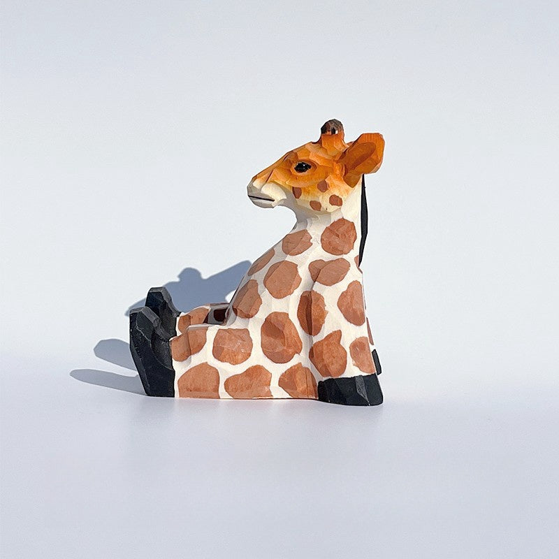 Wooden giraffe, hand carved and painted for cell phone holder.