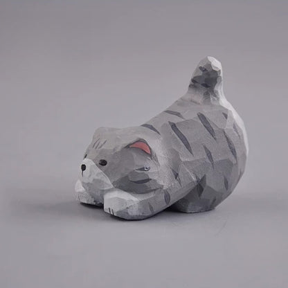 Gray cat figurine side view with raised tail