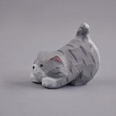 Gray cat figurine side view with raised tail